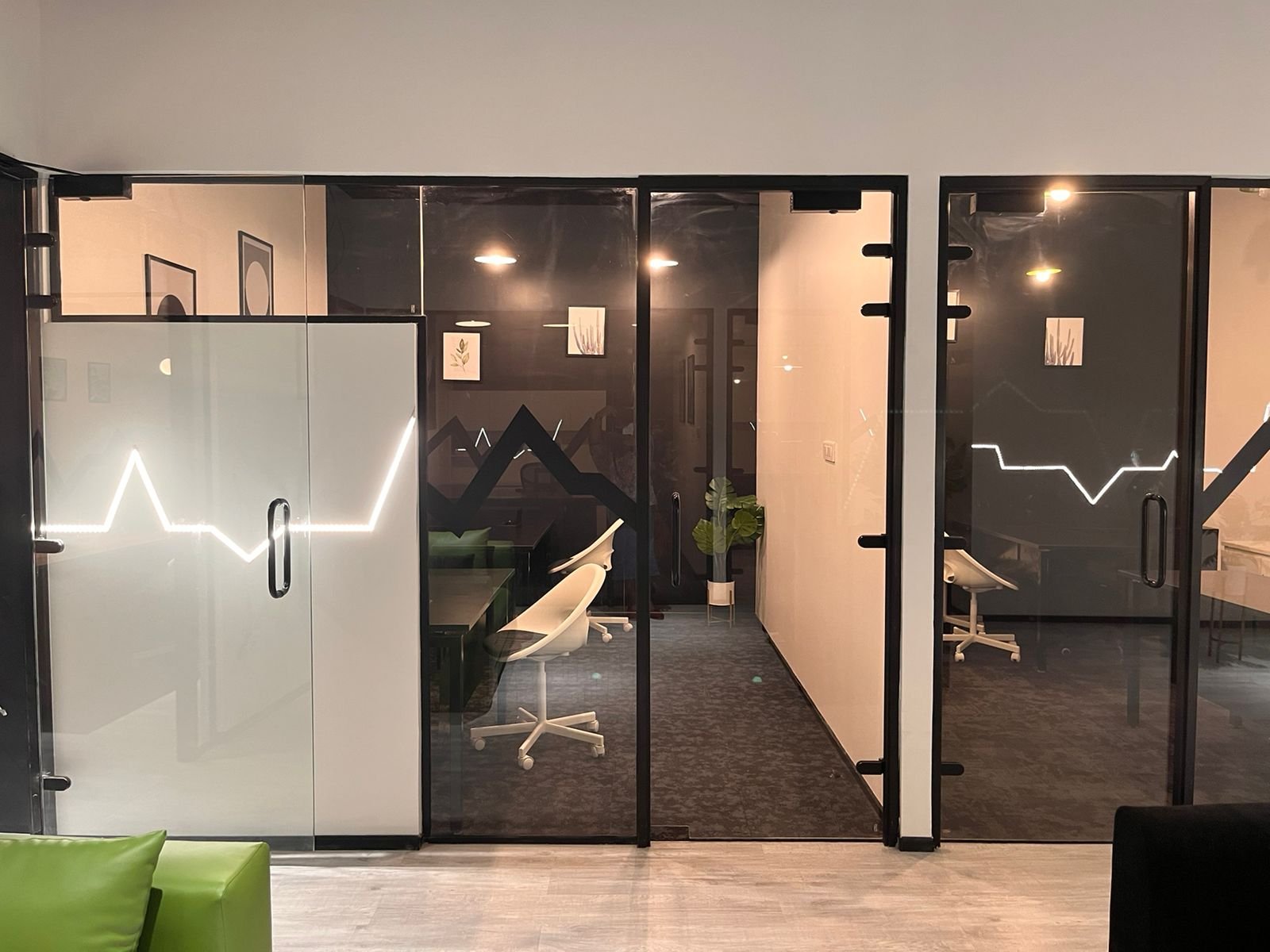 Press Ganey — corridor of glass cabins with heartbeat detailing