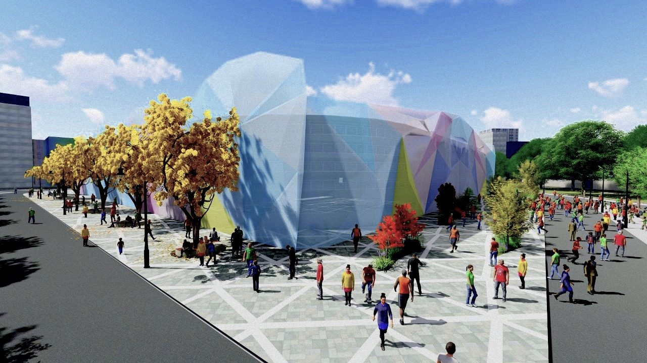 Adaptive Stadium — eye-level view of the faceted coloured-glass prism envelope from the public plaza