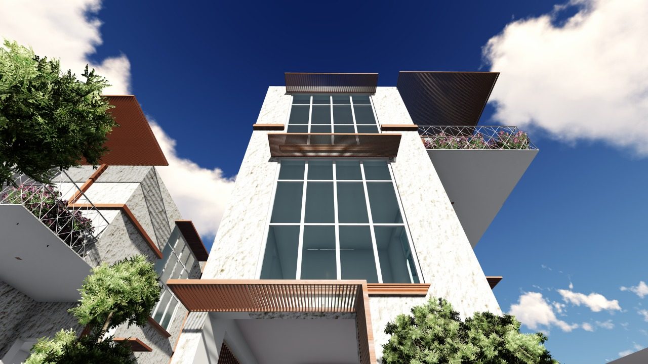 K-Apartments — upward view of the stone-clad stair tower with glazed curtain wall