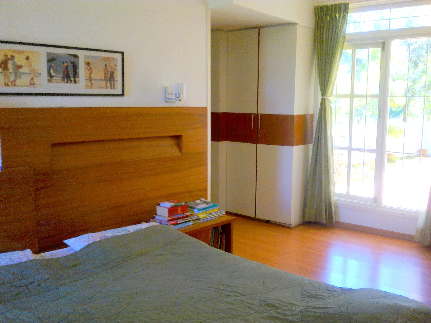 Cedar House — bedroom with cedar wood headboard and built-in wardrobe