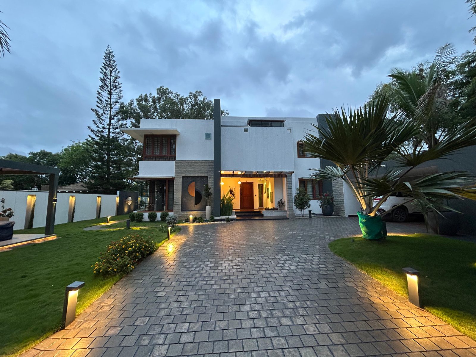 Bafna residence — front façade and lit entrance at dusk