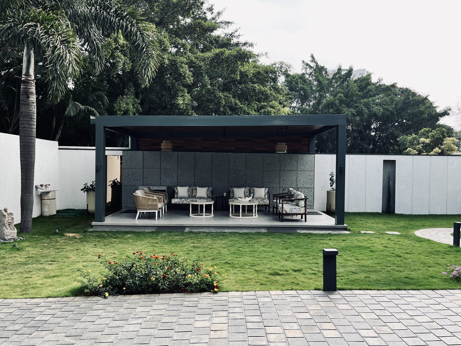 Bafna residence — garden pavilion and lawn by day