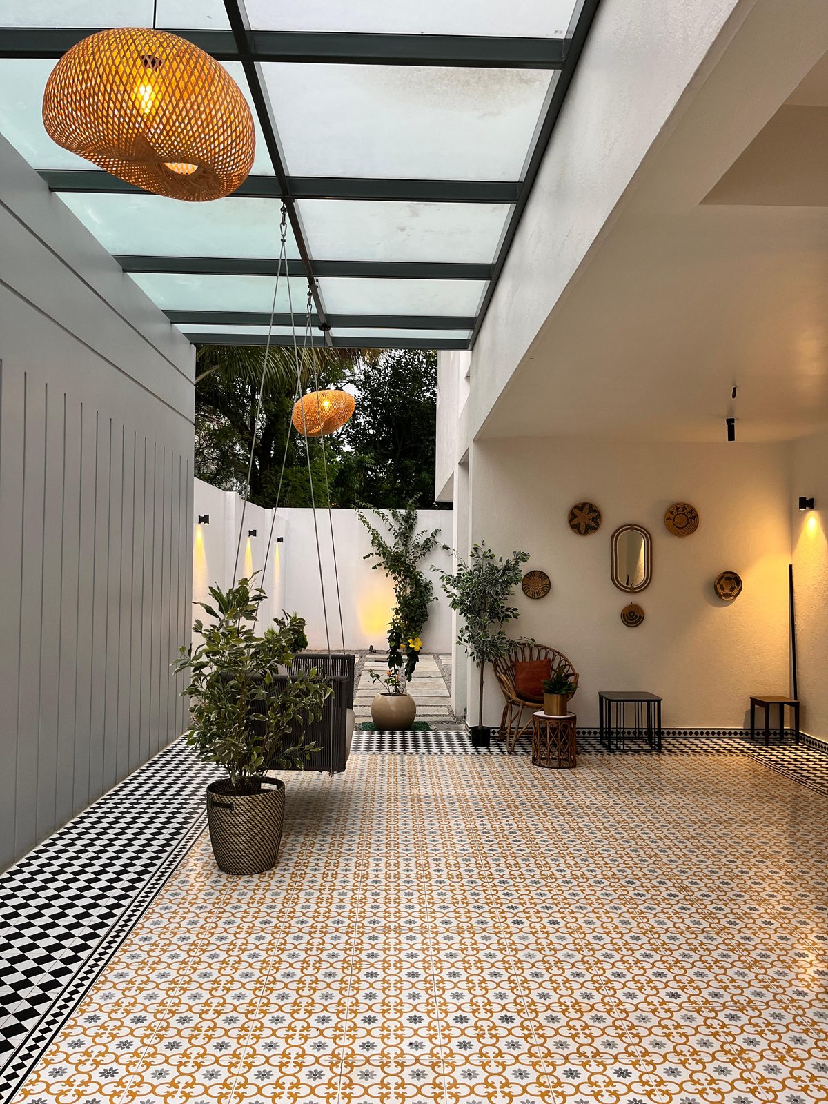 Bafna residence — courtyard with encaustic tilework and woven wall décor