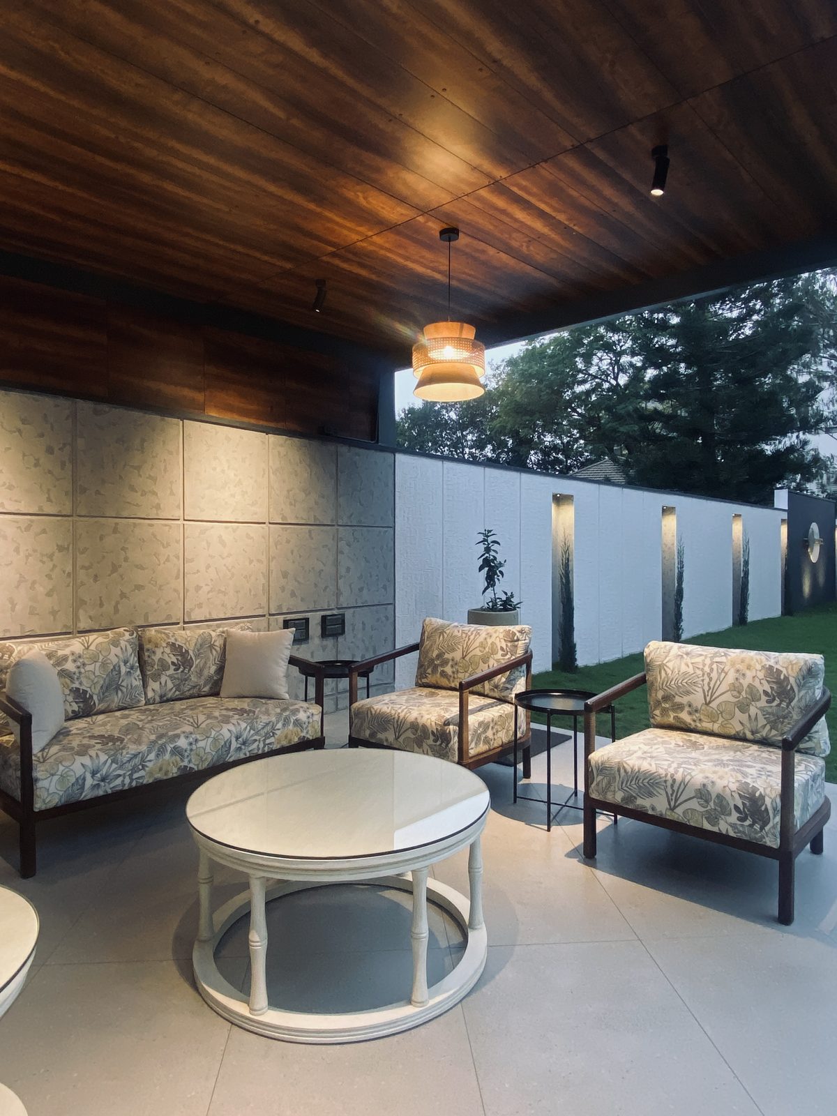 Bafna residence — lounge seating against textured wall