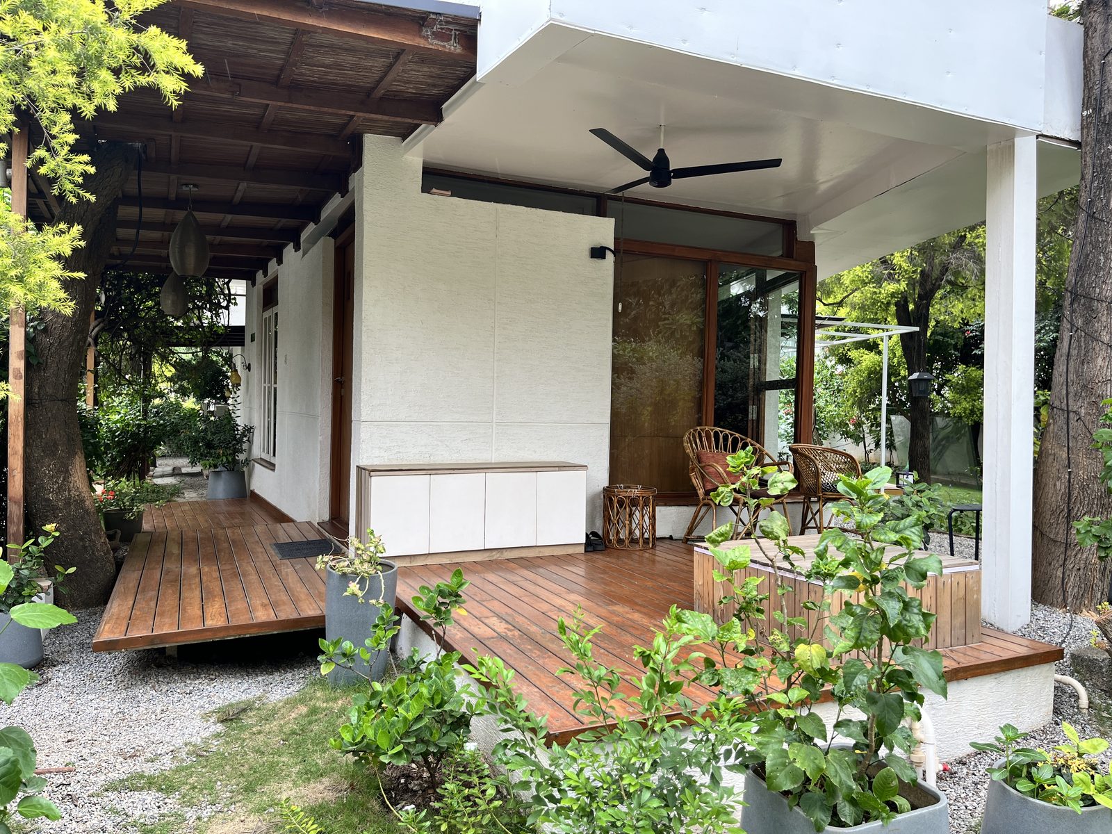TA House — timber deck and verandah extending the living space into the garden