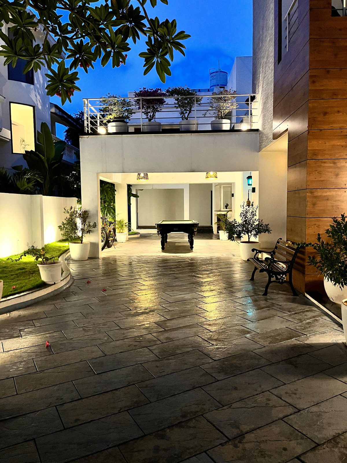 Gilbert — covered entertaining court with games table, planted edges and terrace above