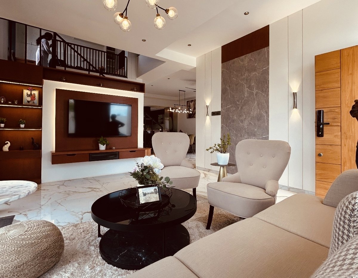 Smart City Bidadi villa — double-height family living with feature media wall