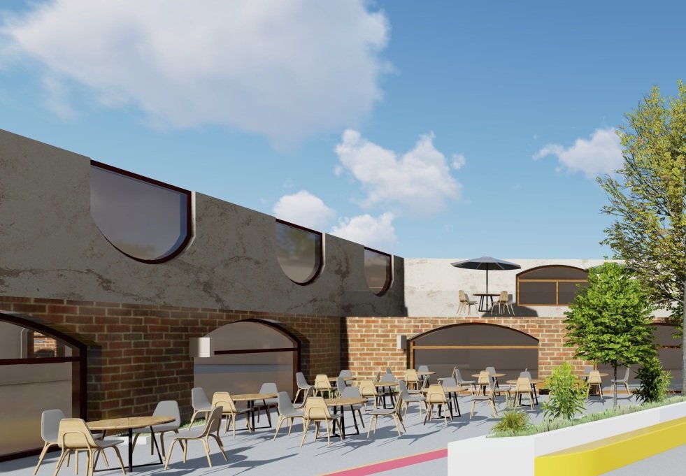 Rahovec — arched brick facade detail with outdoor seating
